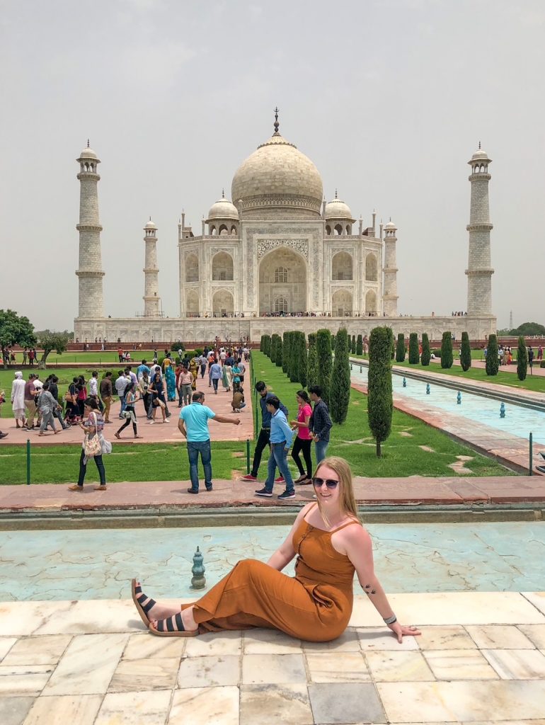 Candace sitting in front of the Taj Mahal