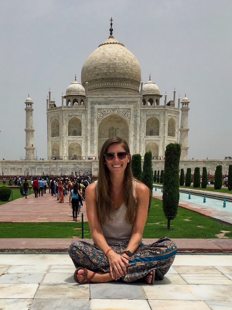 Sara sitting in front of the Taj Mahal