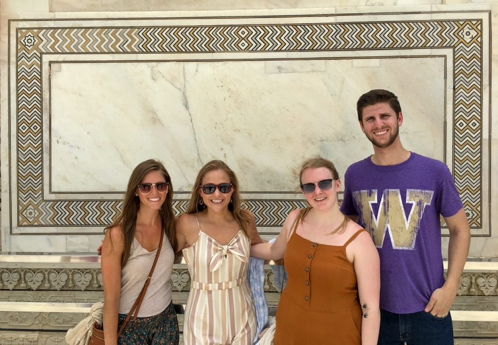 the group framed by a design at the Taj Mahal