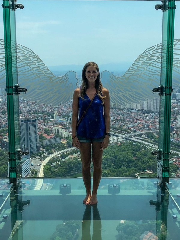 Sara with the wings at the Sky Lotte Observation Deck in Hanoi