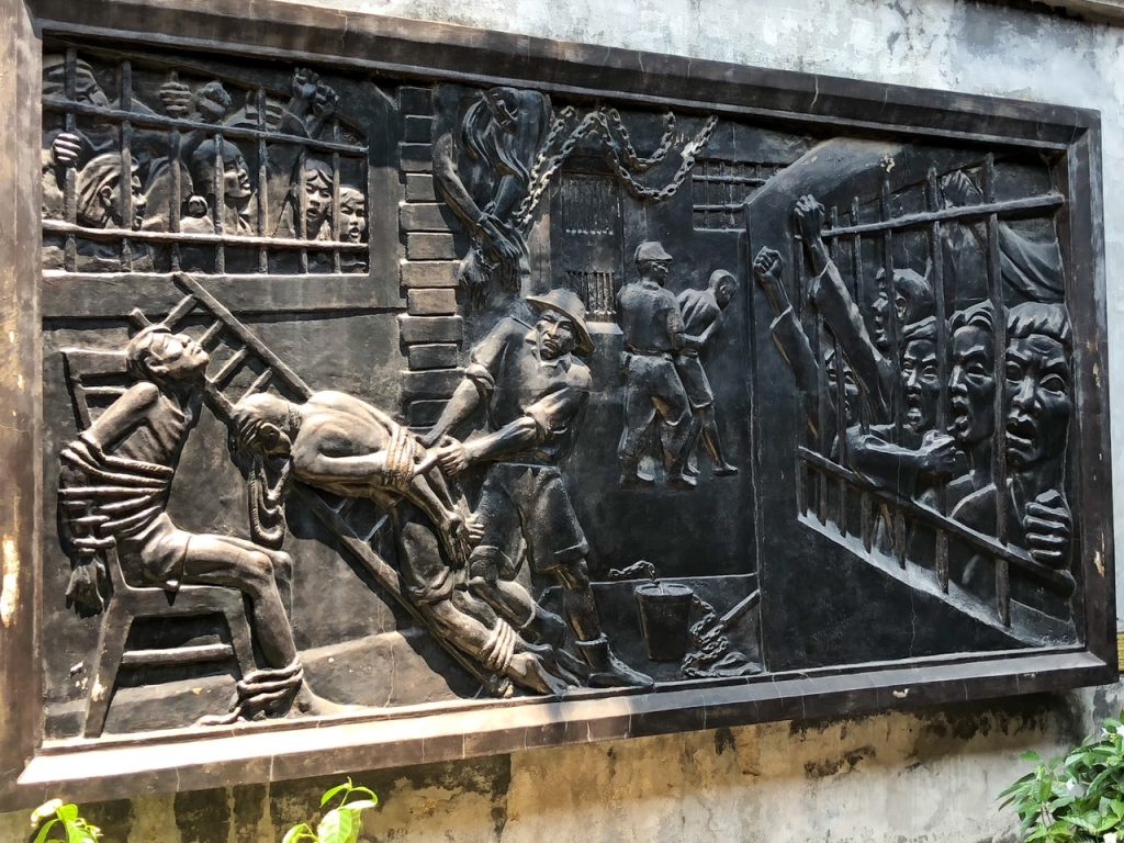 a depiction of prisoners at Hoa Lo Prison in Vietnam