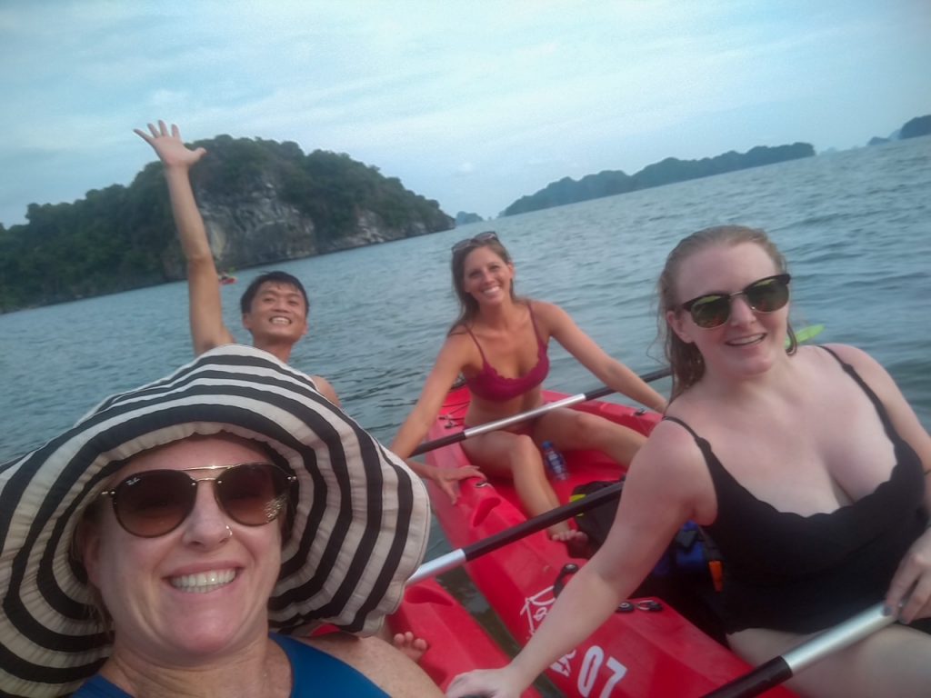 the group kayaking at Bai Tu Long Bay