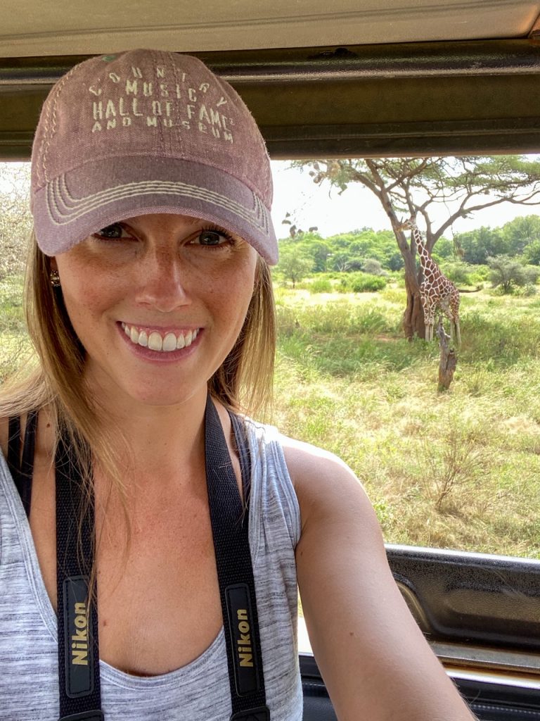 Sara taking a selfie with a Reticulated giraffe on a Kenya safari in Samburu