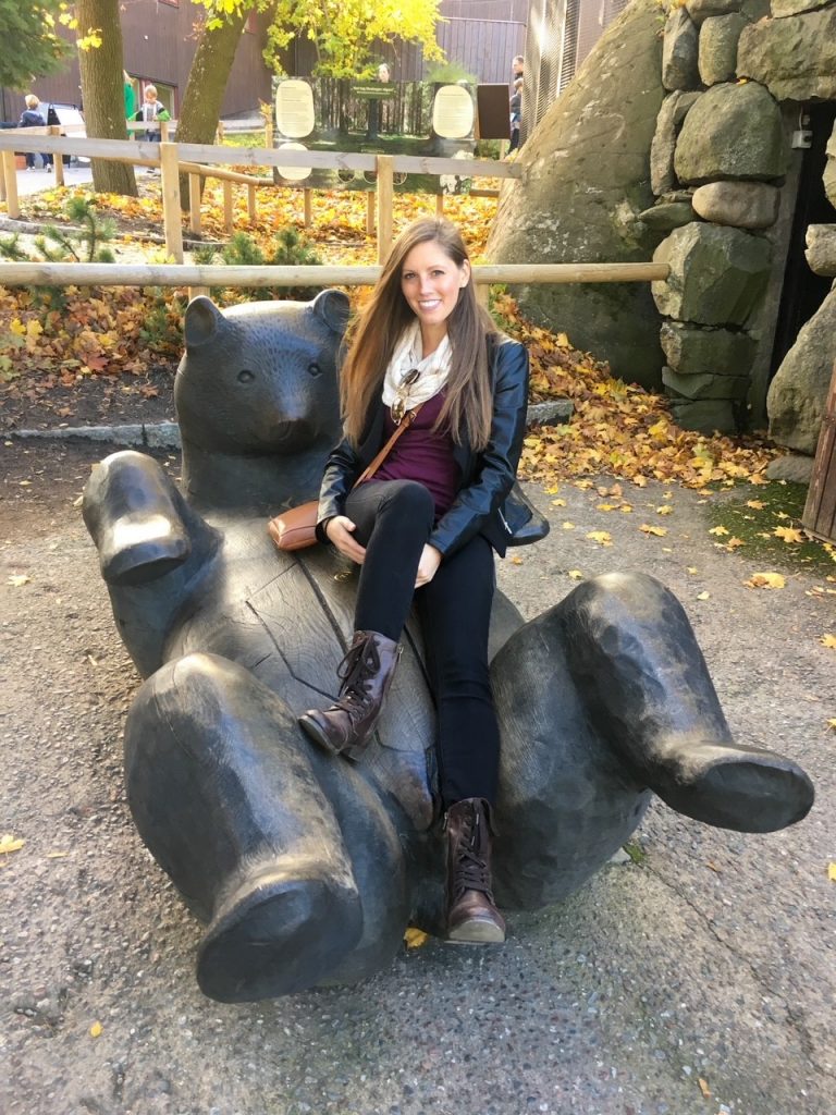 playing on the wooden bear at Skansen