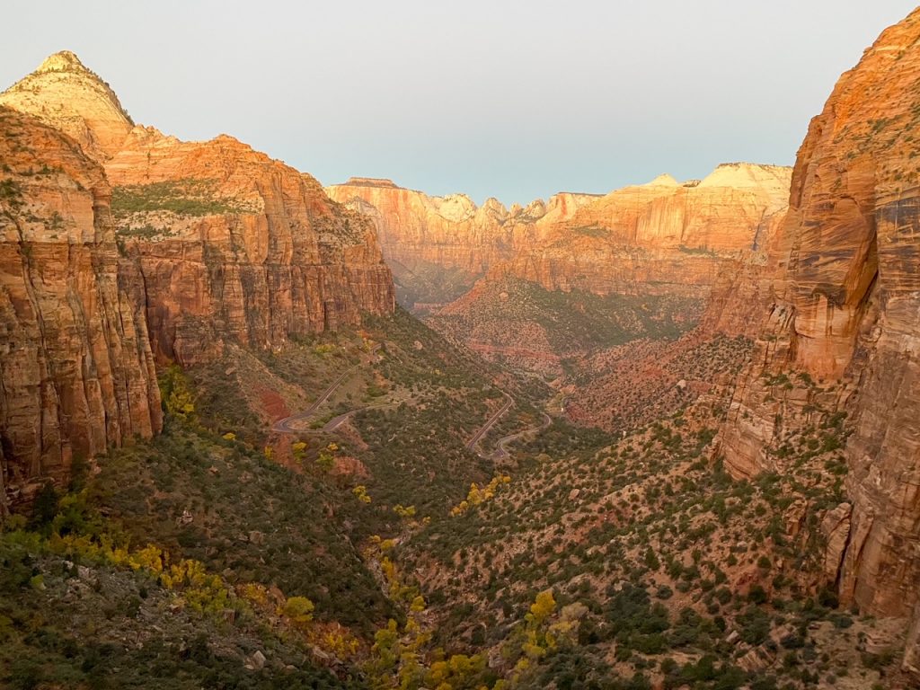 the sun rising at the Zion Canyon Overlook Trail at Zion National Park