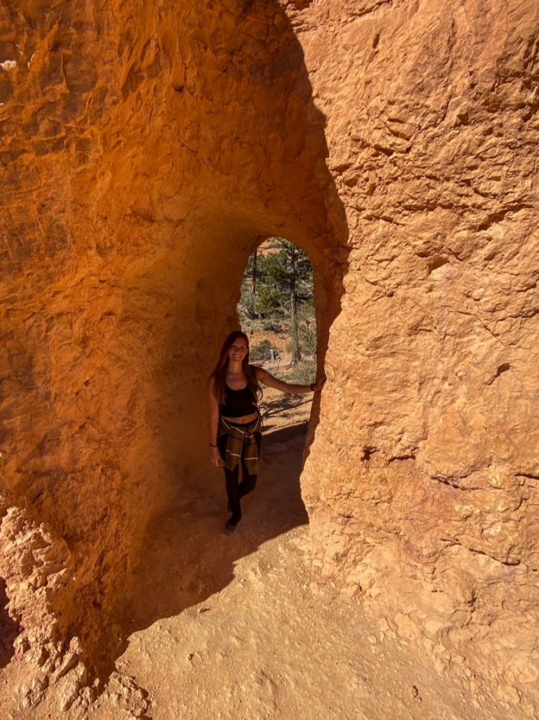 Sara inside a cool rock formation along the Queen's Garden Trail in Bryce Canyon National Park