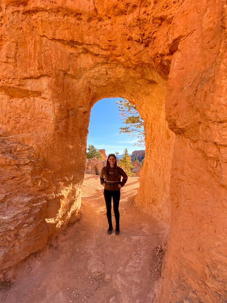 Sara inside a natural arch along the Peekaboo Loop in Bryce Canyon National Park