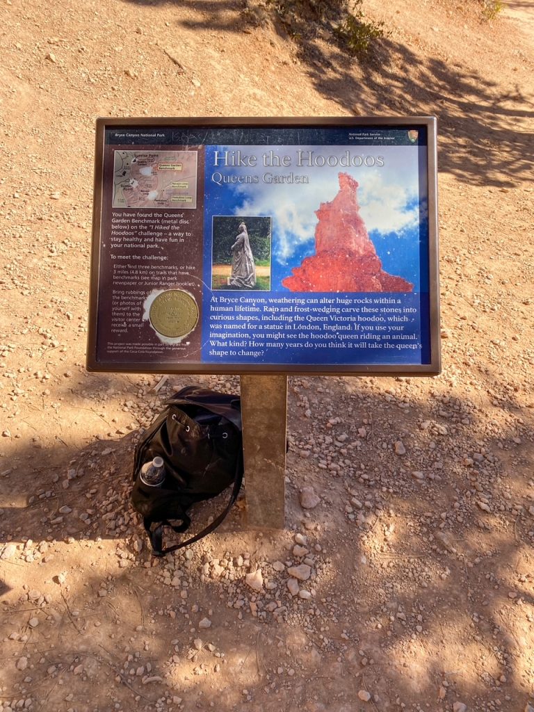 a sign along the Queen's Garden Trail depicting the Queen Victoria hoodoo in Bryce Canyon