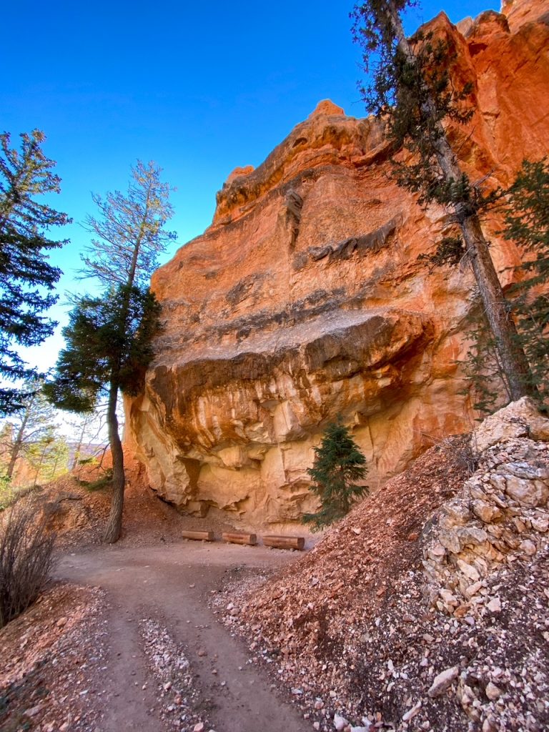 some benches under a canyon wall along the Peekaboo Loop in Bryce Canyon