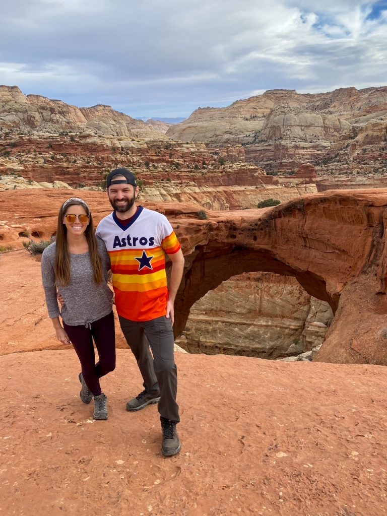 Sara and Tim in front of the famous Cassidy Arch during their one day in Capitol Reef National Park