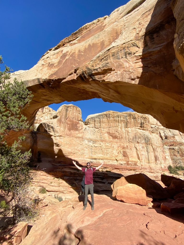 Tim posing under the Hickman Bridge at Capitol Reef National Park