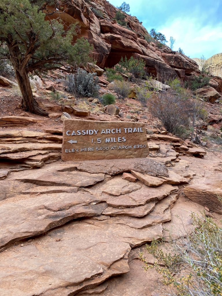 an elevation and mileage sign for the Cassidy Arch Trail, where we started our one day in Capitol Reef