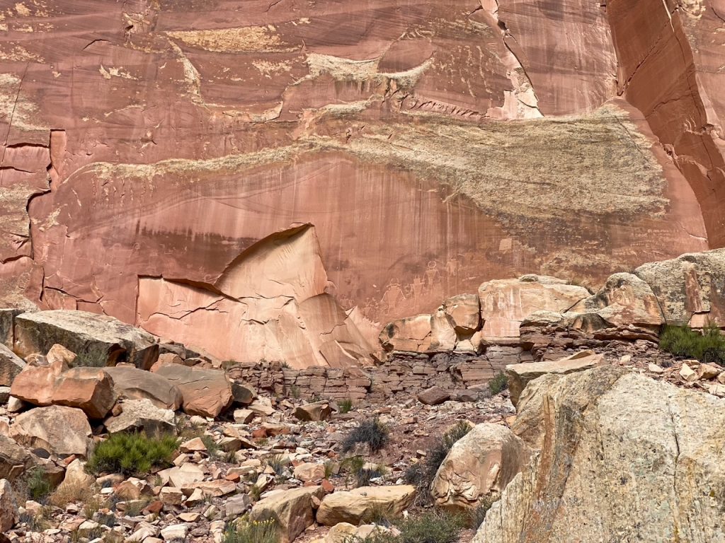 animal and people carvings at the Fremont Petroglyph Panels in Capitol Reef