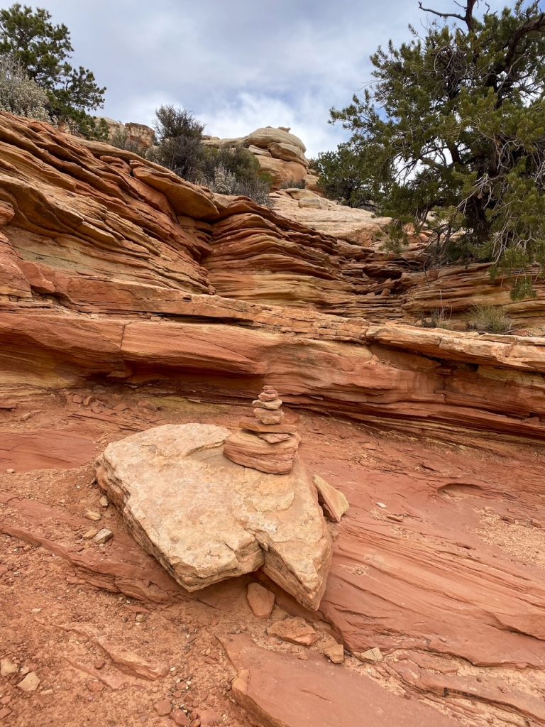 one of the many cairns along the Cassidy Arch Trail, one of the best hikes in Capitol Reef