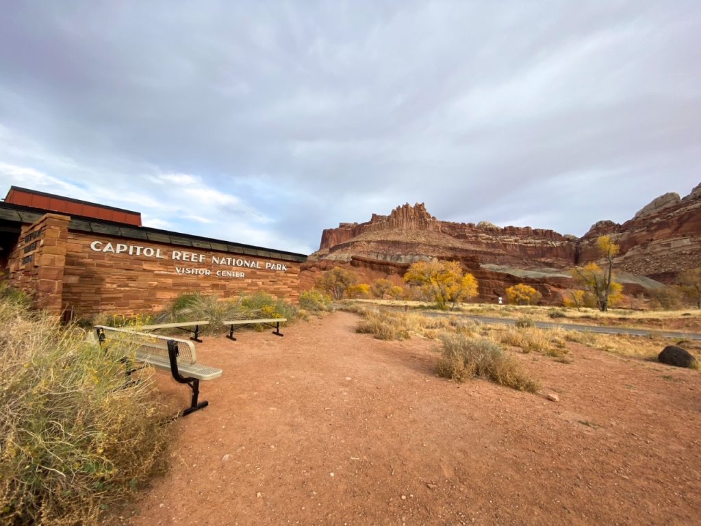the Capitol Reef National Park Visitor Center with The Castle rock formation in the background