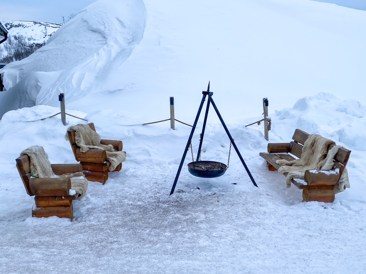 an adorable outdoor set-up at the Snowhotel Kirkenes & Gamme Northern Lights Cabins