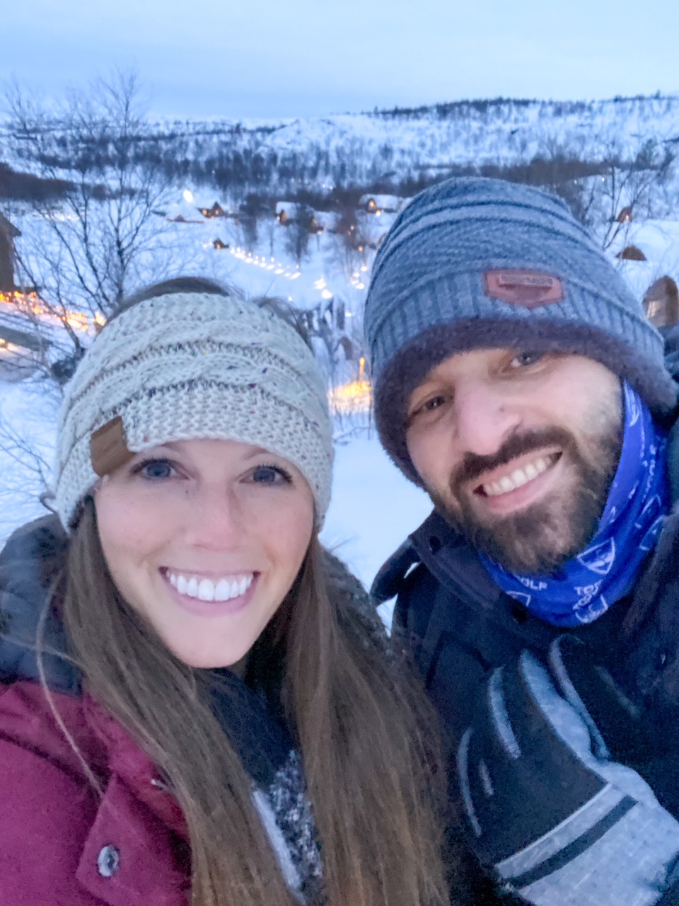 Sara & Tim snowshoeing at the Snowhotel Kirkenes & Gamme Northern Lights Cabins
