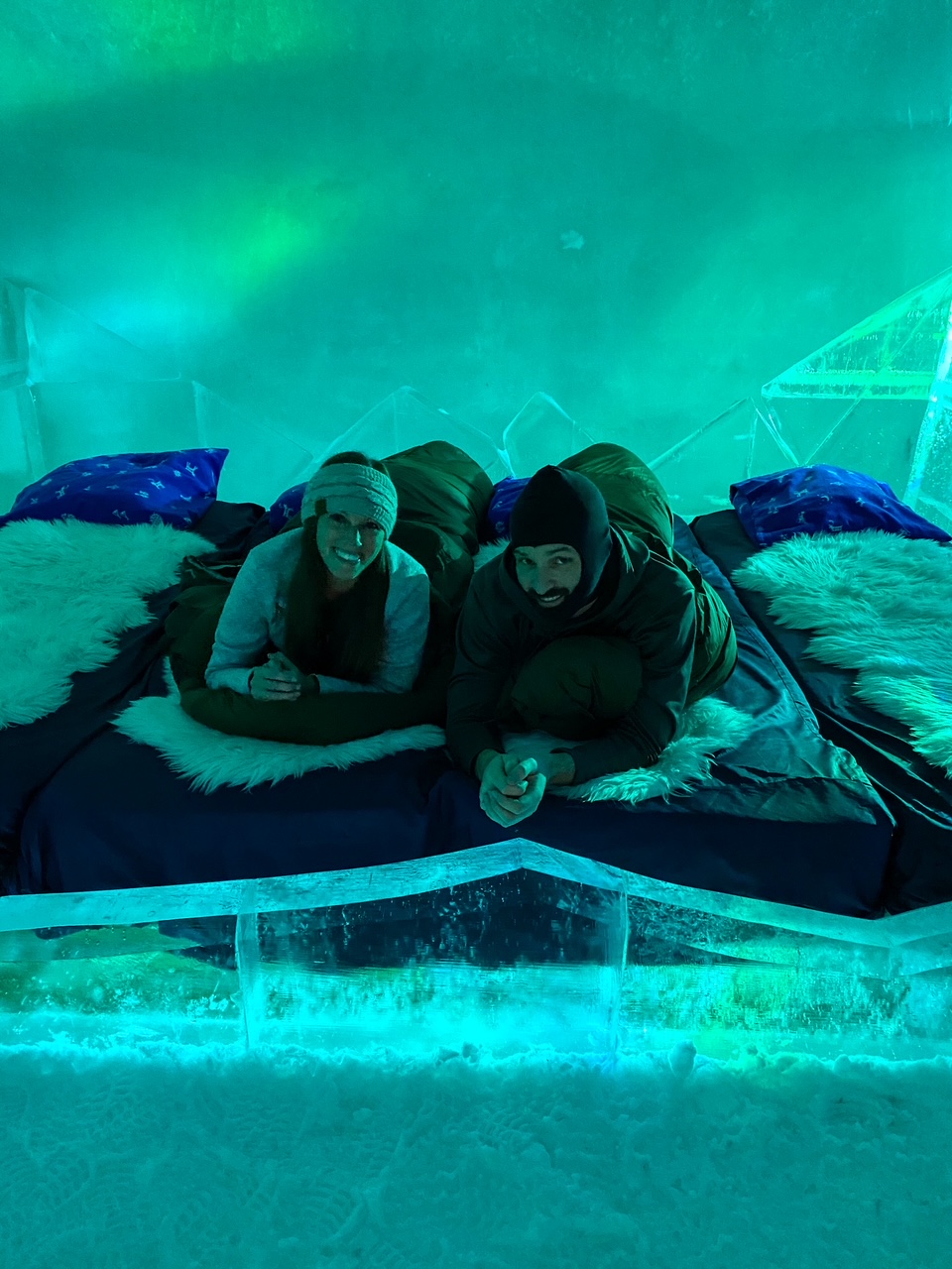 Sara & Tim posing inside their Snowhotel Kirkenes room