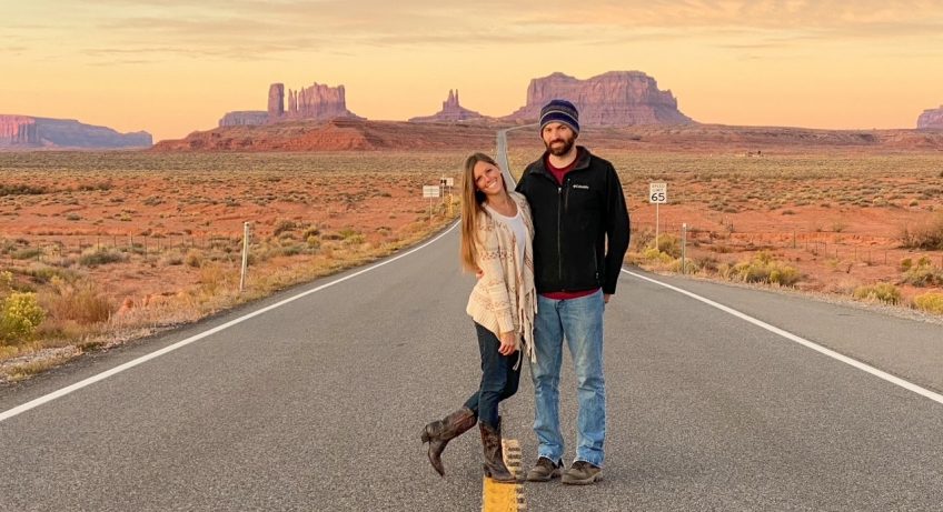 Sara and Tim at Forrest Gump Point in Mexican Hat Utah at sunrise