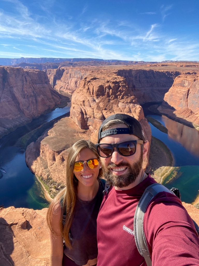 Sara and Tim taking a selfie in front of Horseshoe Bend in Page, AZ
