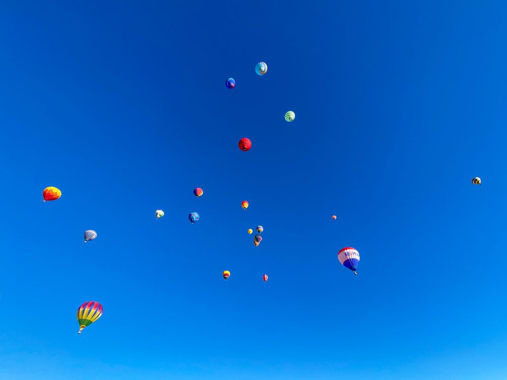more than 50 colorful balloons take flight during the annual Lake Powell Balloon Regatta in Page, AZ