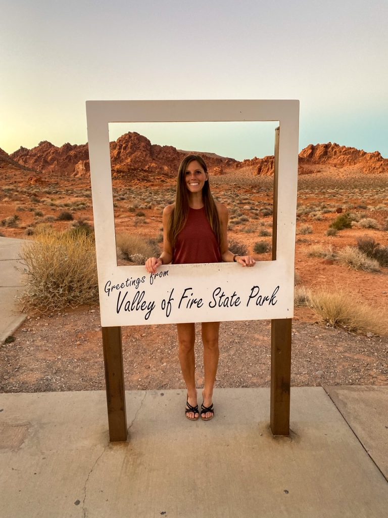 Sara with the Greetings from Valley of Fire State Park sign