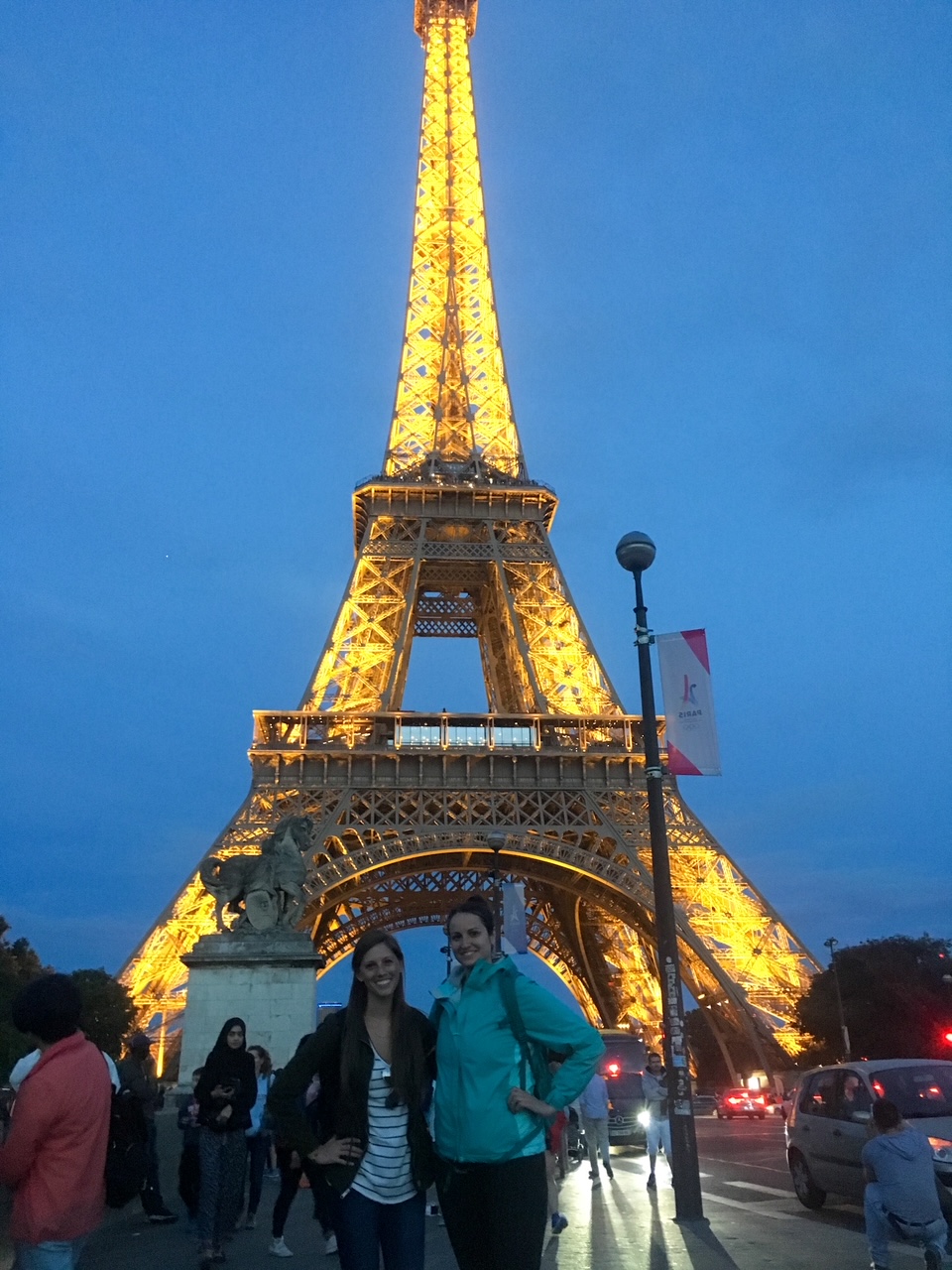 Sara and Katie at the Eiffel Tower at night