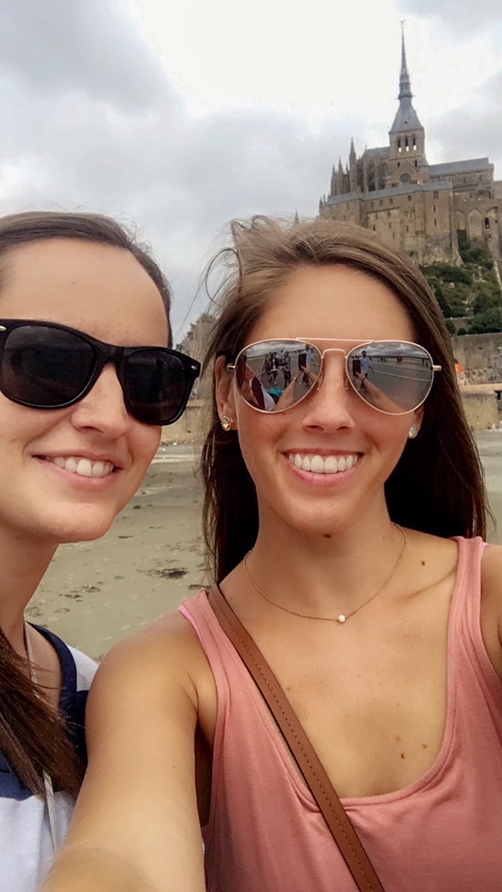 a selfie in front of Mont Saint-Michel