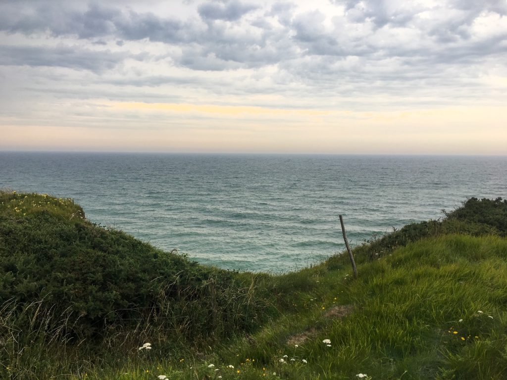 a view of the ocean from Pointe du Hoc