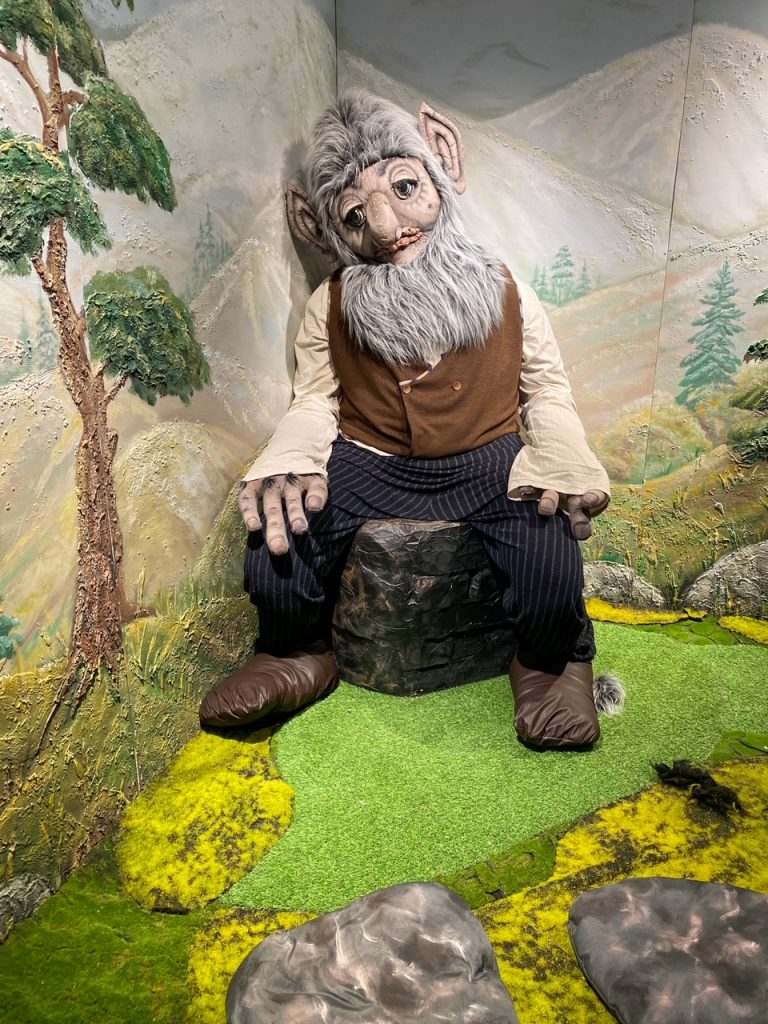 a sad looking troll at the Tromsø Troll Museum