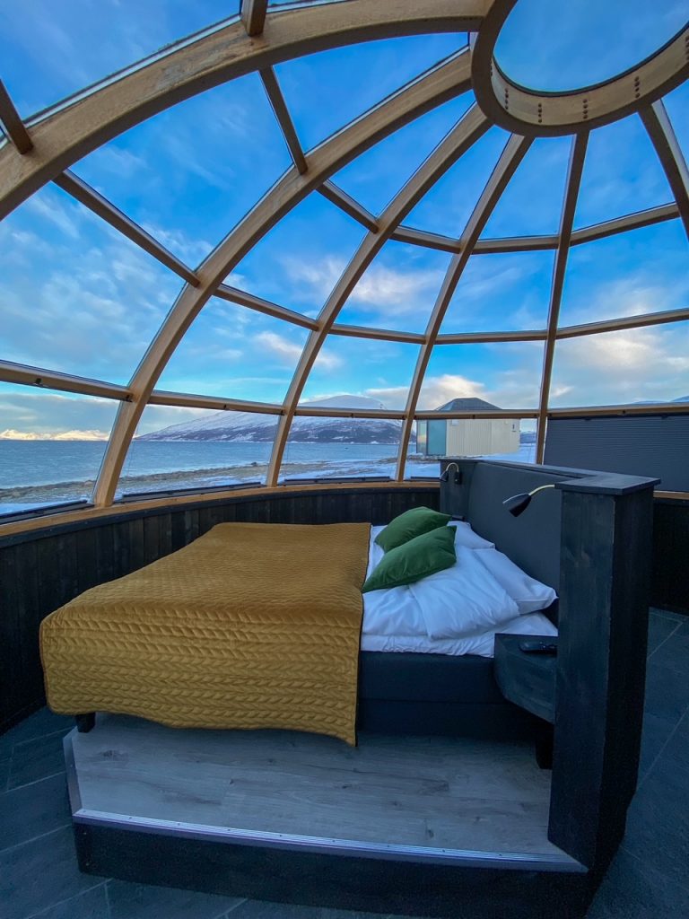 the bed inside the 360 degree glass igloo at Lyngen North Igloo Hotel
