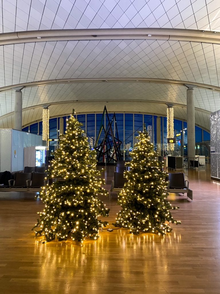 the Oslo Airport decorated with Christmas trees in February