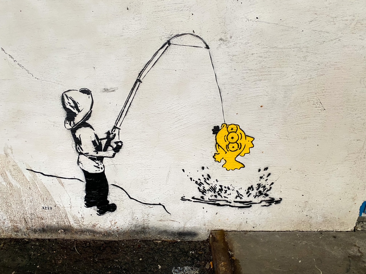 boy with a pishing pole street art in Bergen