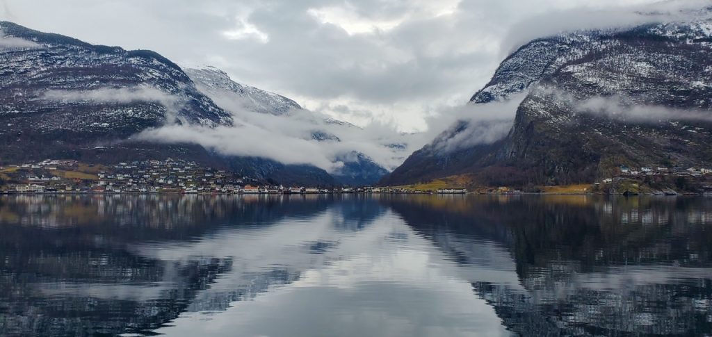 panoramic mountain and village views on the Norway in a Nutshell fjord cruise
