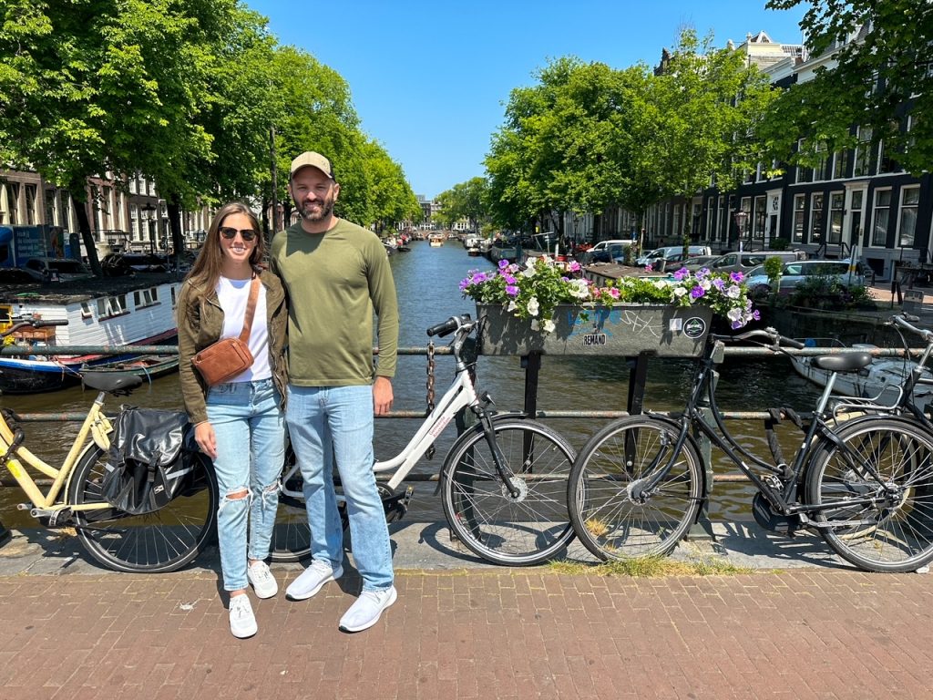 Sara & Tim in front of some bikes in Amsterdam in June