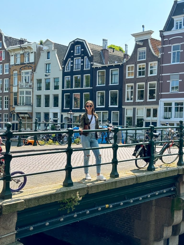 Sara overlooking a canal in Amsterdam, the Netherlands