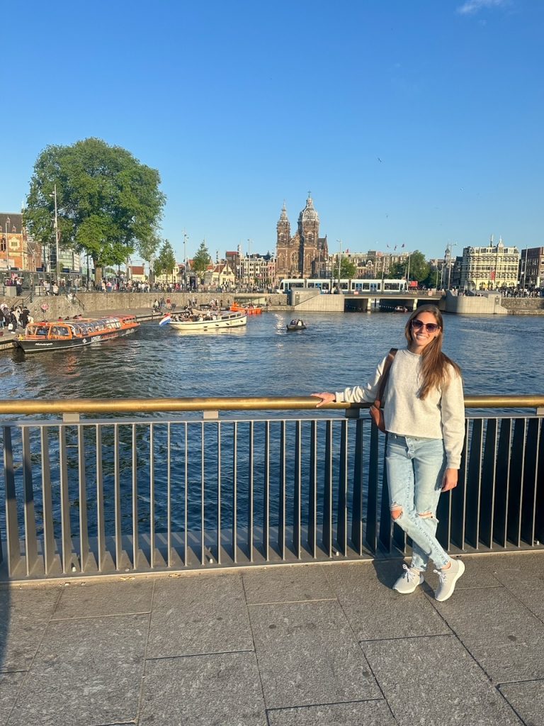 Sara by a canal near Central Station in Amsterdam in the spring