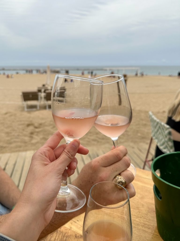 Sara & Tim cheersing at Barceloneta