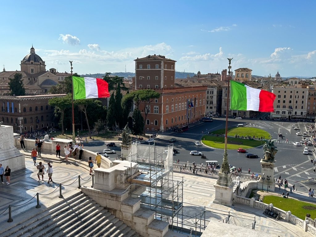 Italian flags waving in the wind at the Complesso Vittoriano in Rome, Italy
