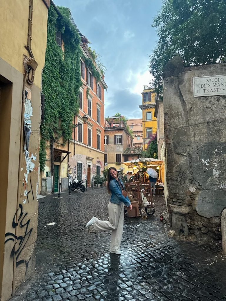 Sara walking around in the rain in Trastevere