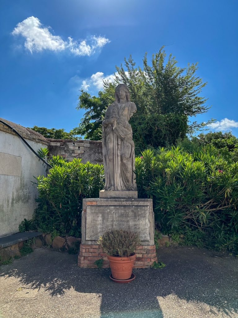 a statue outside the Catacombs of Domitilla