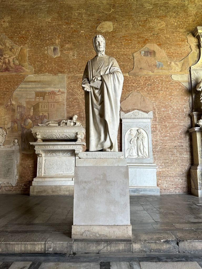 a statue of Fibonacci at the Camposanto in Pisa