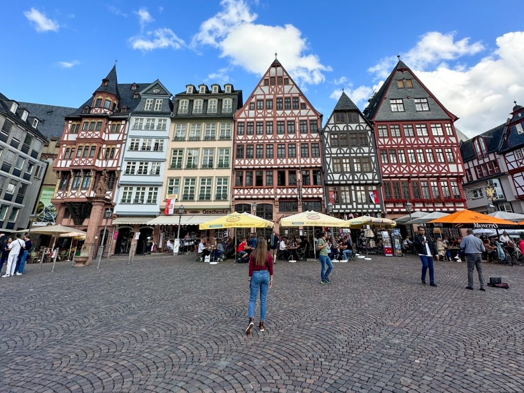 Sara admiring the half-timbered houses of Römerberg, one of the top things to do in Frankfurt