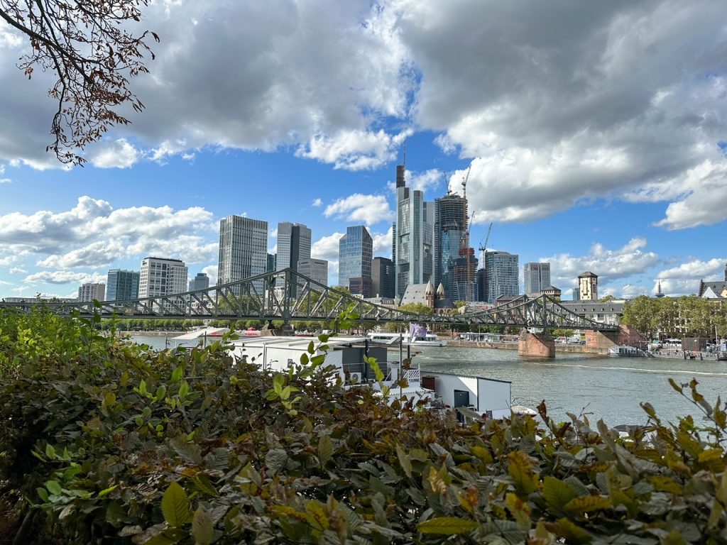 walking across the Eiserner Steg and seeing the Frankfurt skyline is one of the best things to do in Frankfurt