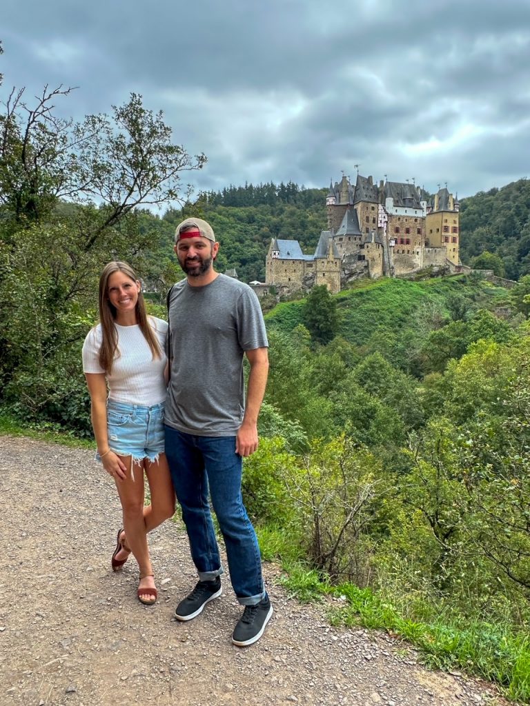 Couple at Eltz Castle viewpoint Moselle Valley in Germany