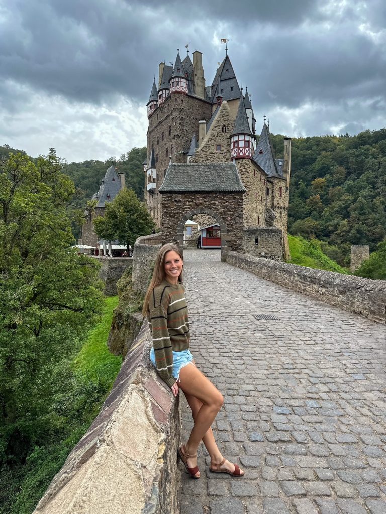 Sara sitting in front Eltz Castle