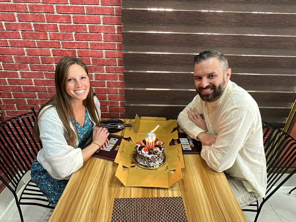 Sara & Tim at lunch in Jaipur with their surprise cake