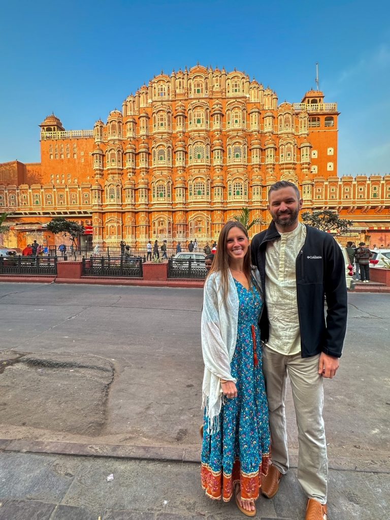 Sara & Tim in front of Hawa Mahal in Jaipur, one of the stops on every Golden Triangle tour