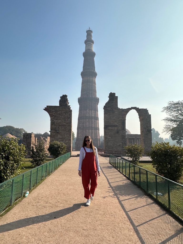 Sara at Qutub Minar in Delhi, a must-see on any Golden Triangle Tour