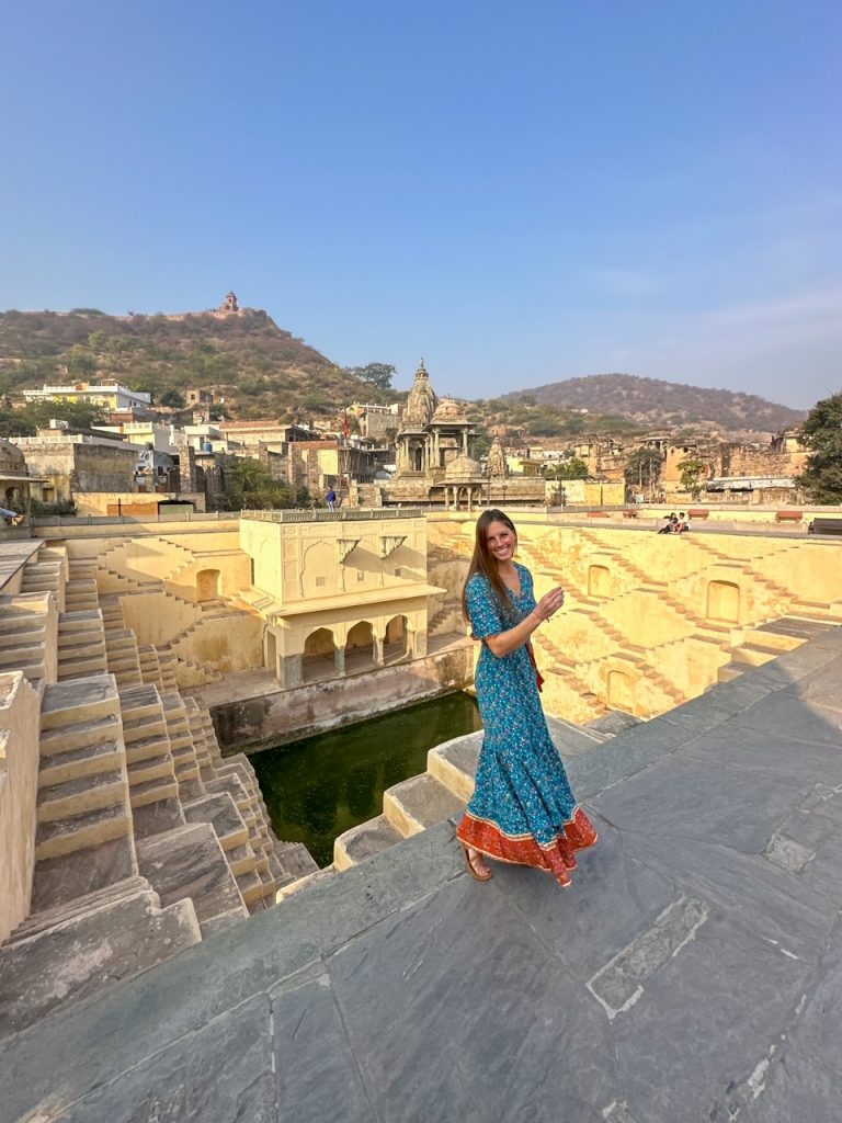 Sara standing in front of Panna Meena Ka Kund in Jaipur